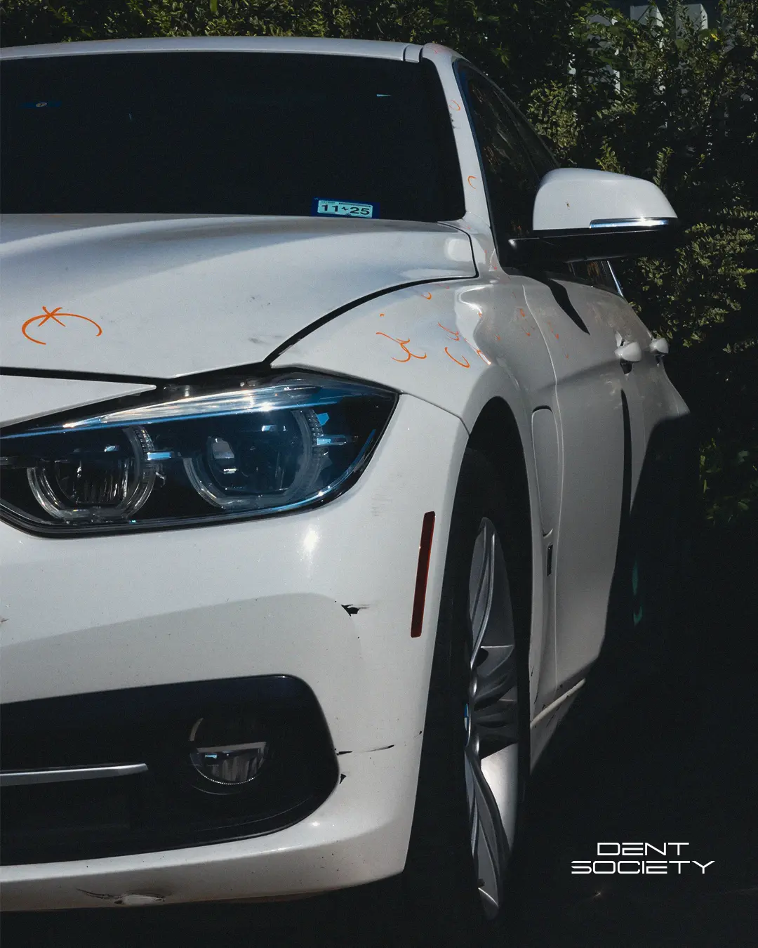 Clean detailed white BMW after PDR and post-repair detailing